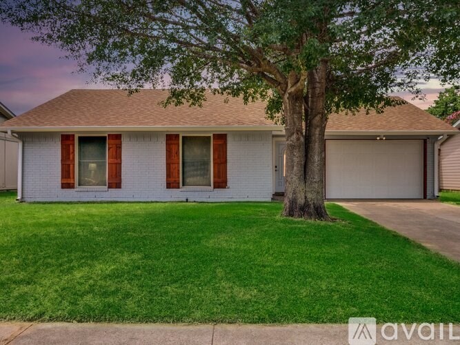 A house with a tree in front of it.