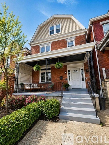 A house with a red brick exterior and a white door.