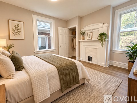 A bedroom with a large bed and a window.