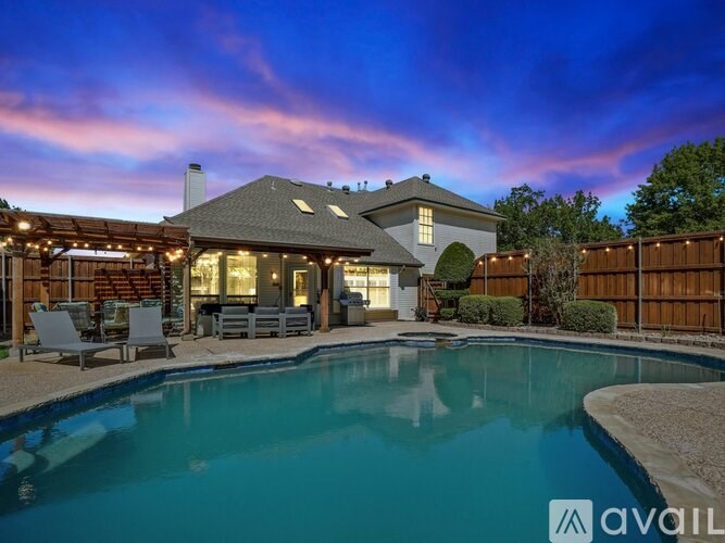 A house with a pool in the backyard.
