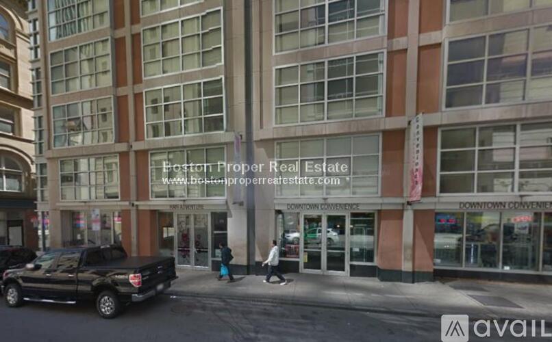 A building with a sign that says "Easton Proper Real Estate" on it.