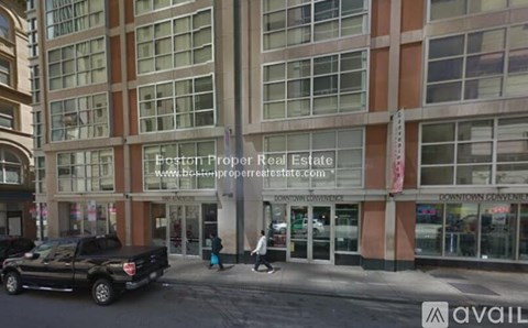 A building with a sign that says "Easton Proper Real Estate" on it.