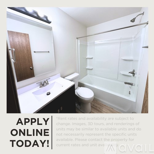 A small bathroom with a toilet, sink, and bathtub.