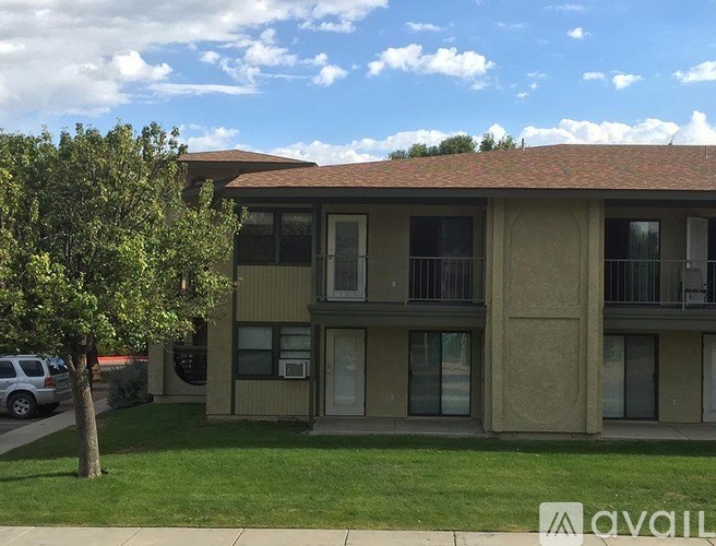 A building with a tree in front of it.