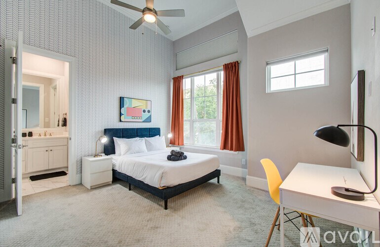 A modern house with a hot tub in the backyard.