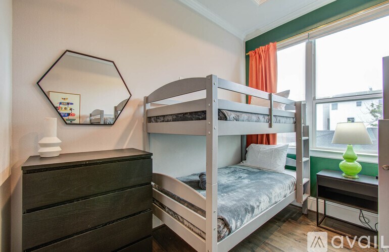 A floor plan of a house with two bedrooms, a living room, a kitchen, a bathroom, and a drinking area.