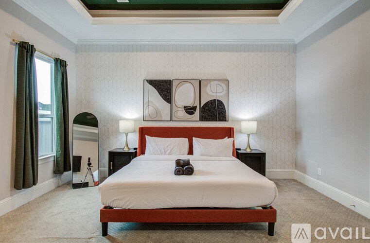 A dining room with a table and chairs.