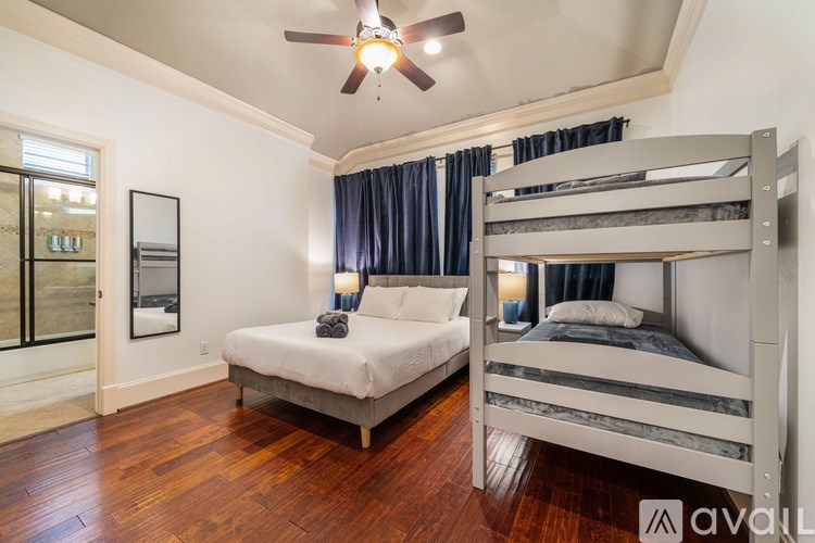 A bedroom with a bunk bed and a single bed.