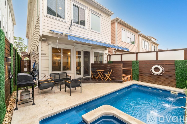 A living room with a fireplace and a television.