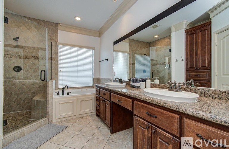 A pool with a hot tub and a barbecue grill.