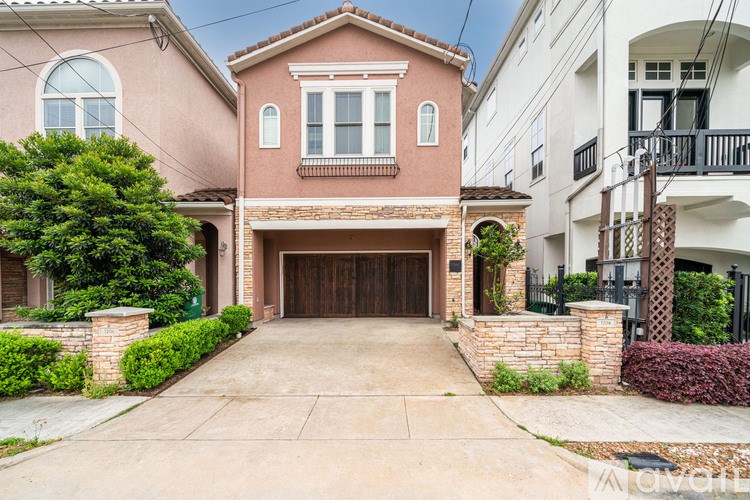 A house with a brown garage door is for sale.