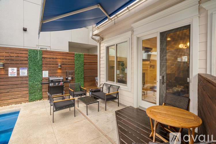 A patio with a table and chairs is shown.