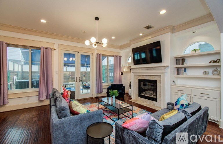 A kitchen with a stainless steel oven and blue cabinets.