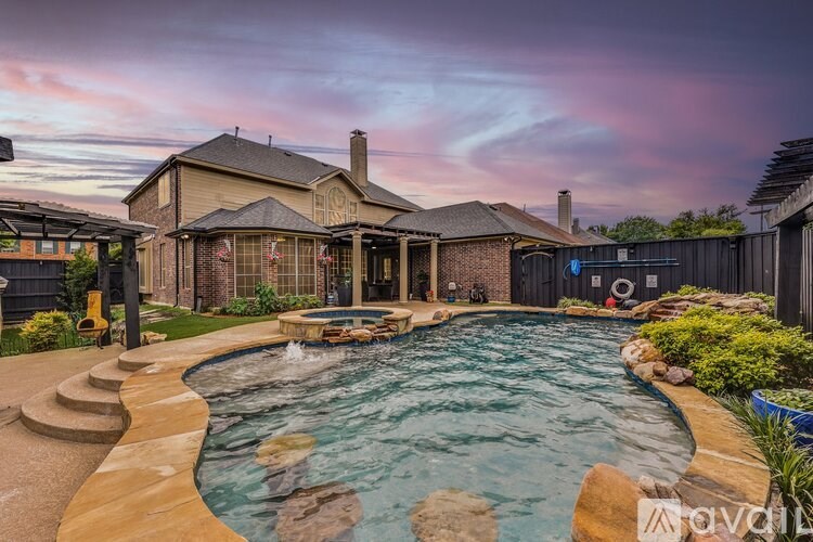 A house with a pool in the backyard.