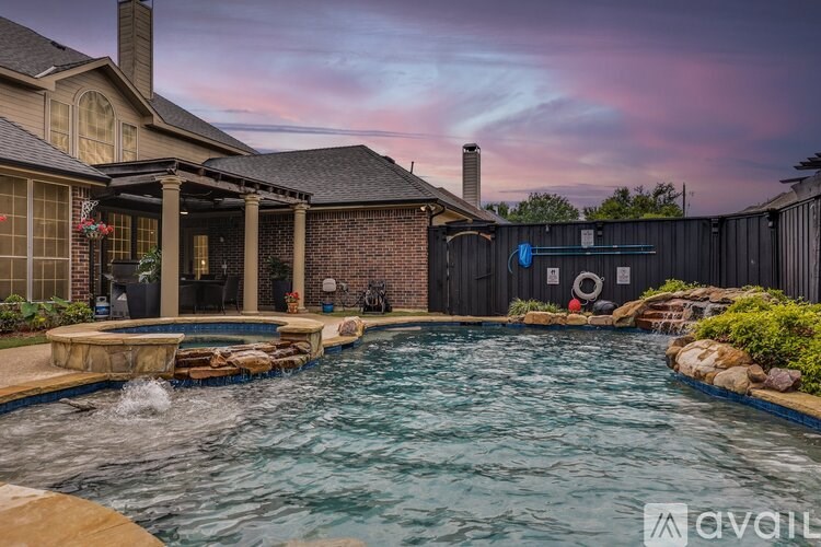 A house with a pool in the backyard.