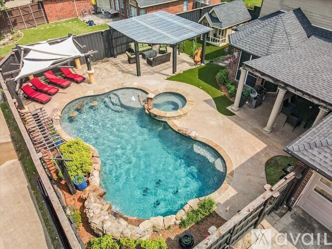 A backyard with a pool and a hot tub.