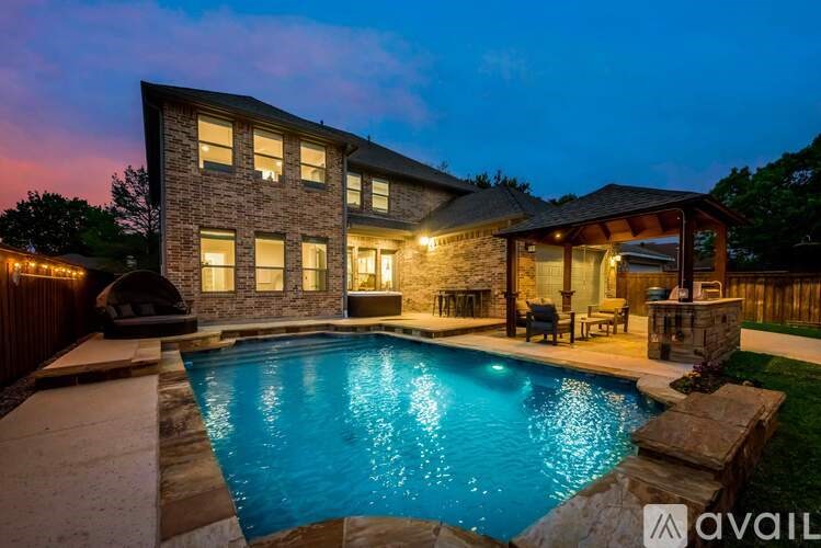 A house with a pool in the backyard.