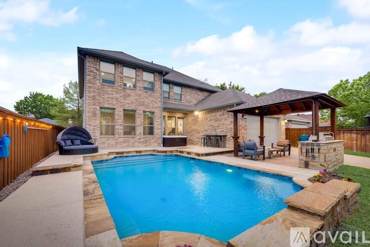 A house with a pool in the backyard.