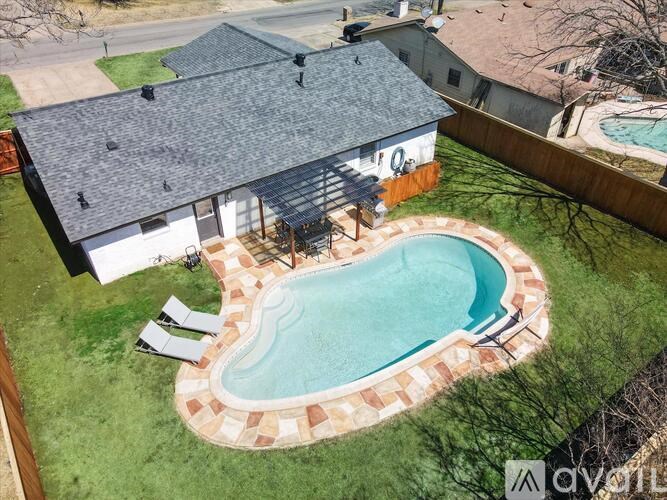 A house with a pool in the backyard.