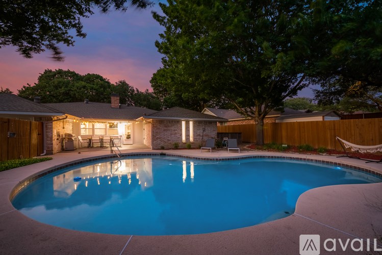 A house with a pool in the backyard.