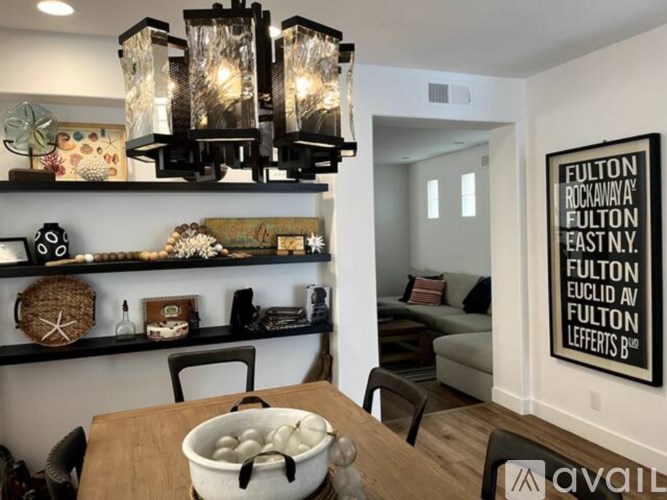 A living room with a Fulton sign on the wall.