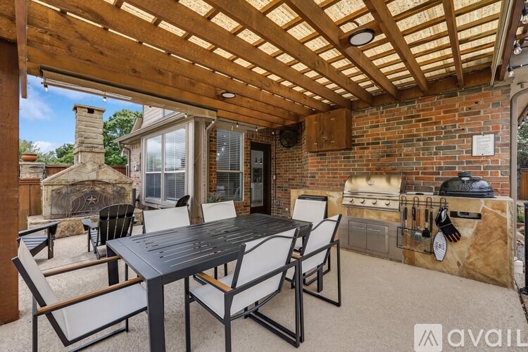 A patio with a table and chairs is available for rent.