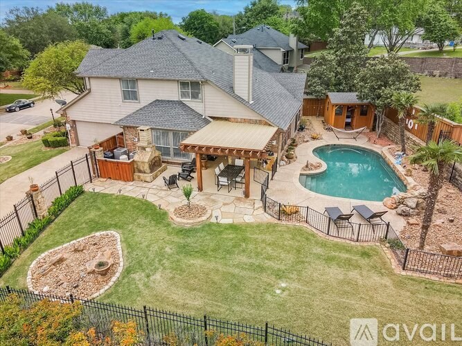 A house with a pool and a patio area.