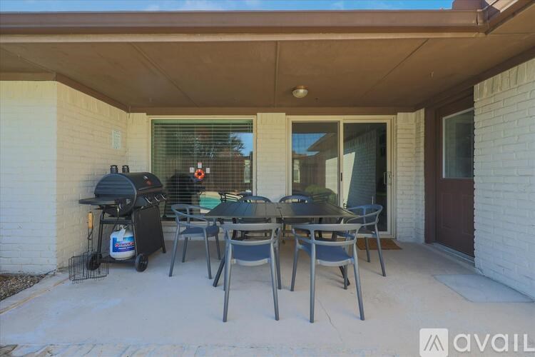A patio with a table and chairs is available for rent.