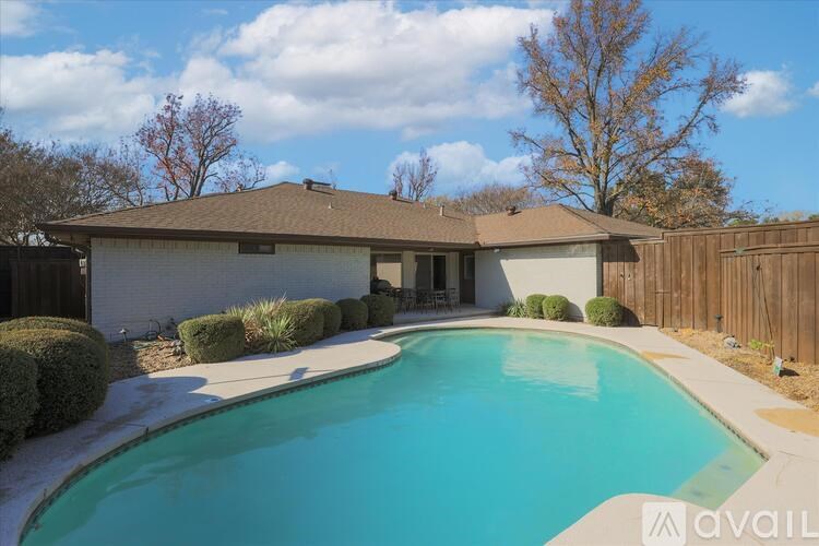 A house with a pool in the backyard.