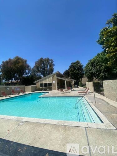 A swimming pool with a building next to it.