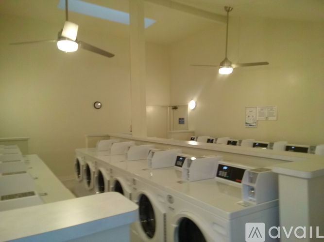 A row of washing machines in a laundromat.