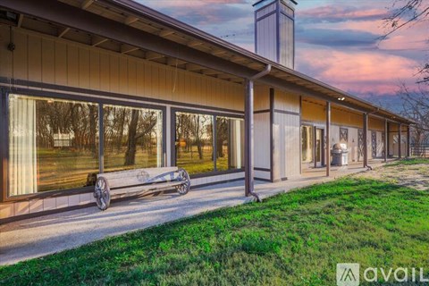 A building with a bench in front of it.