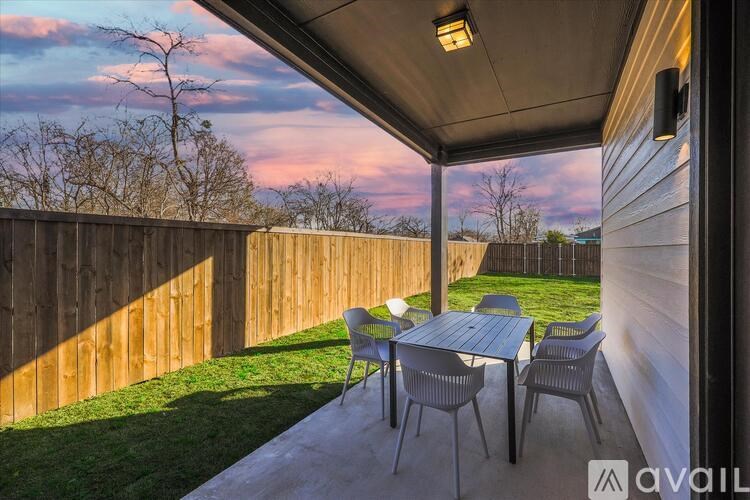 A patio with a table and chairs is available for rent.