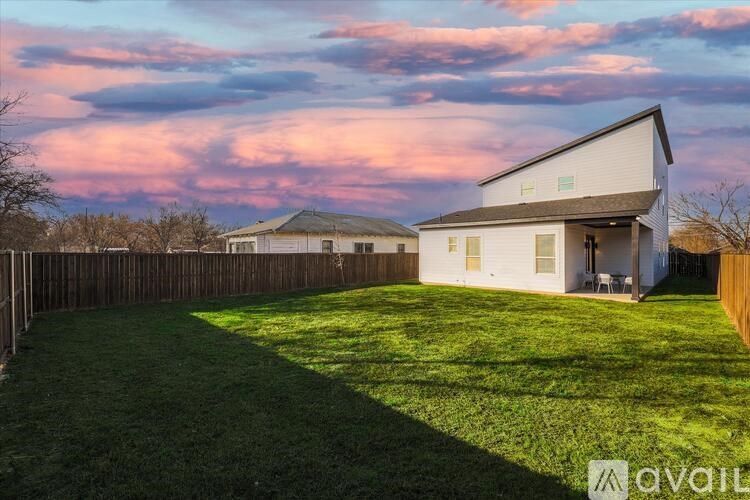 A house with a yard is for sale.