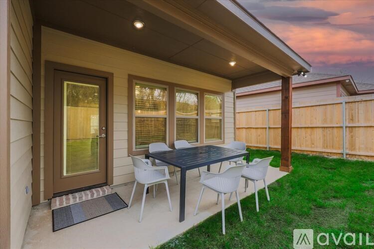 A patio with a table and chairs is available for rent.