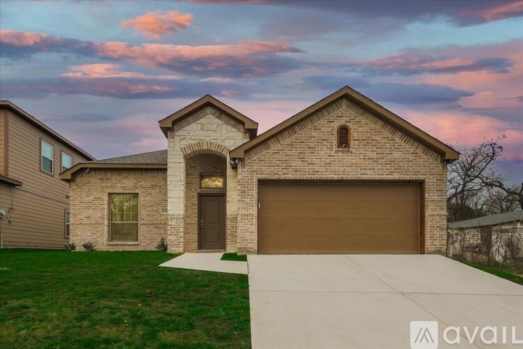 A house with a brown garage door is available for sale.