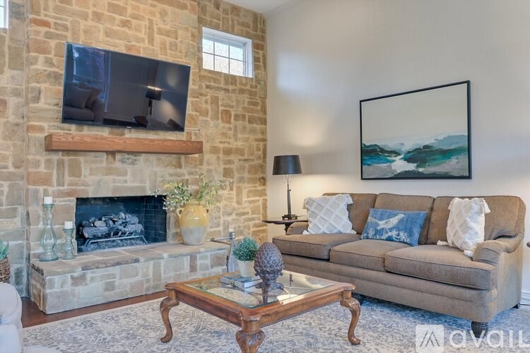 A living room with a fireplace and a couch.