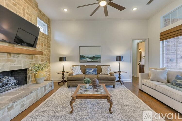A living room with a fireplace and a couch.