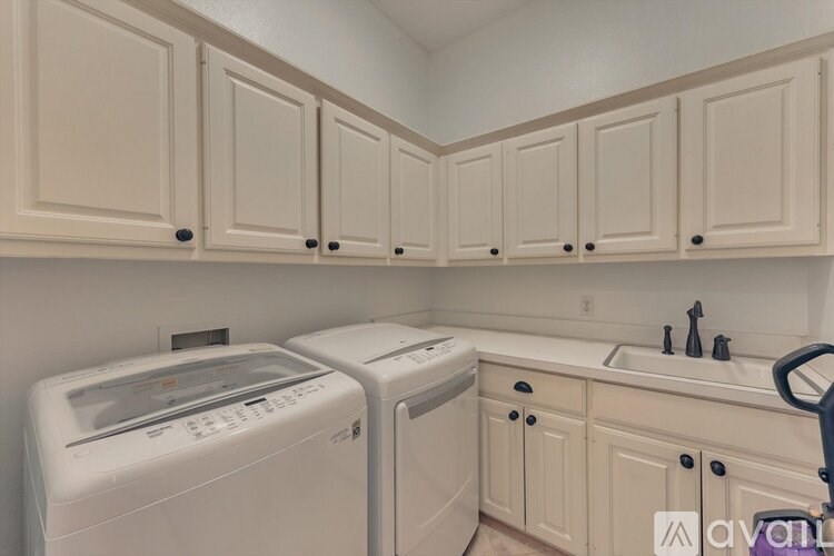A laundry room with a washer and dryer.