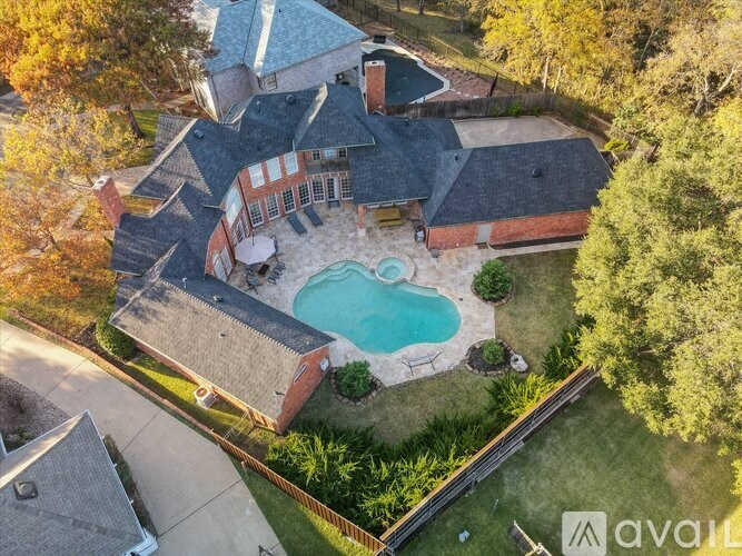 A house with a pool in the backyard.