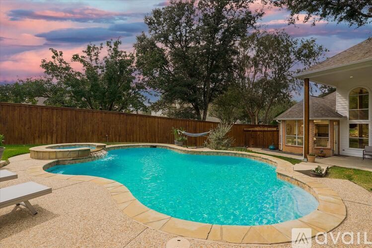 A backyard with a small pool and a deck.