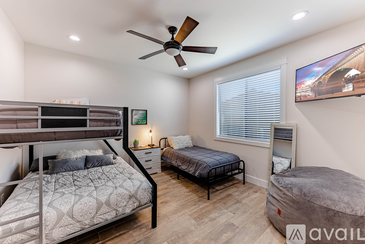 A bedroom with a bunk bed and a single bed.