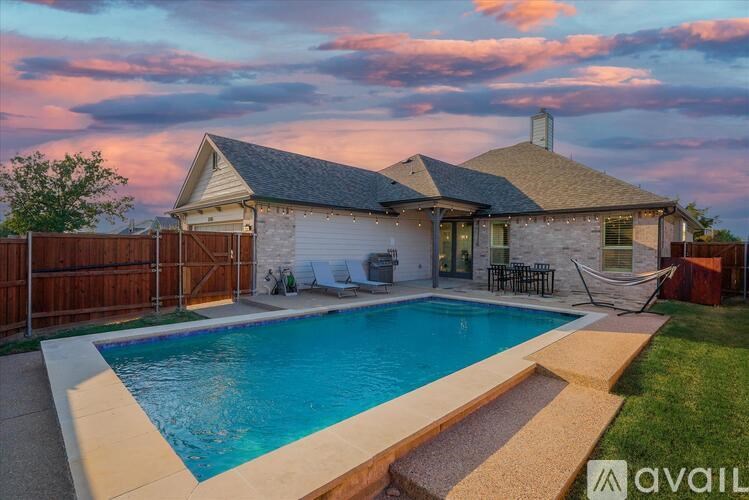 A house with a pool in the backyard.