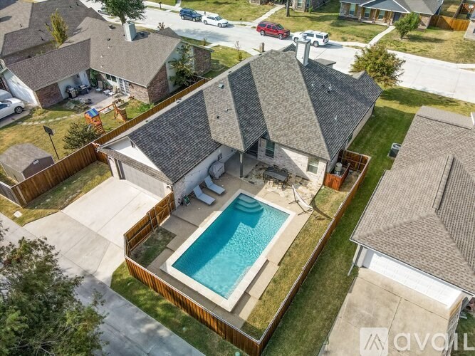 A house with a pool in the backyard.