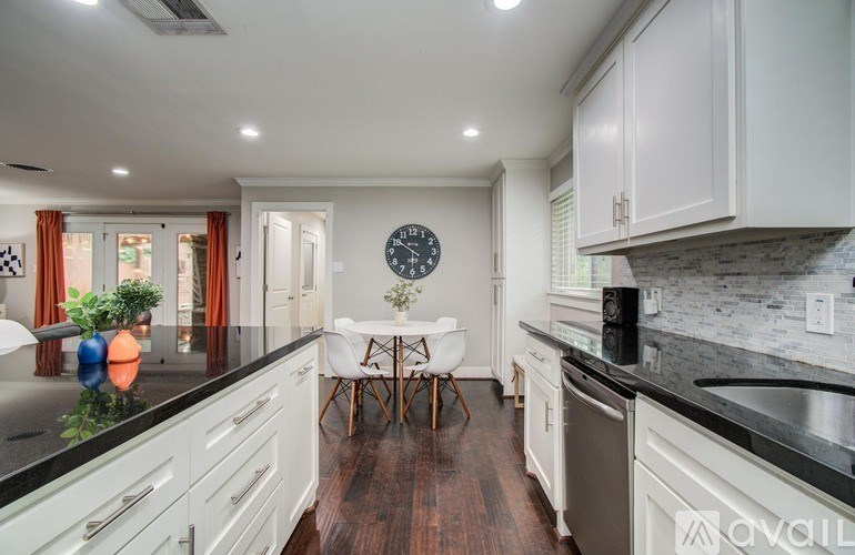 A bedroom with a bed, bunk beds, and a window.