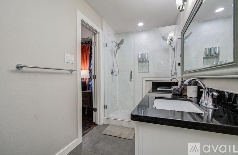 A wooden bench is placed on a concrete floor.
