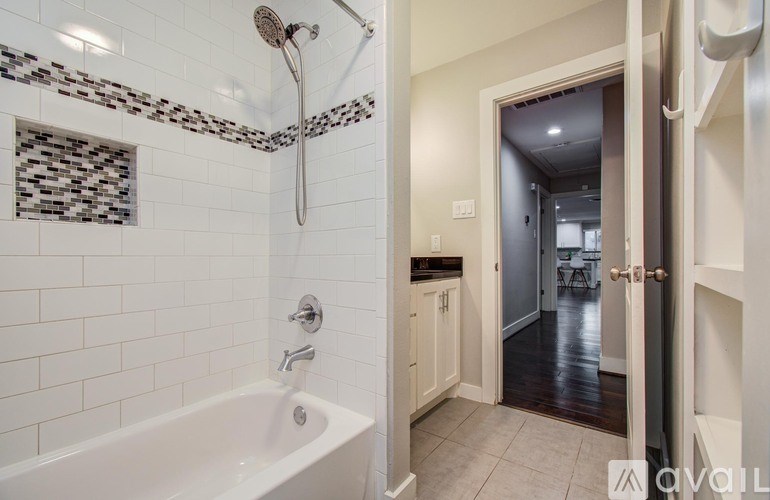 A backyard with a pool and patio furniture.