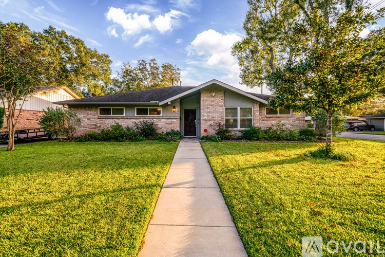 A house with a lawn in front of it.