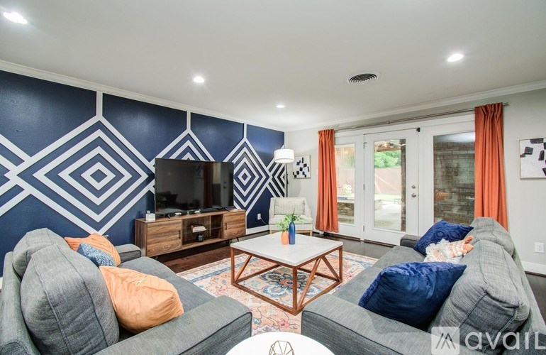 A kitchen with a table and chairs in the middle of the room.