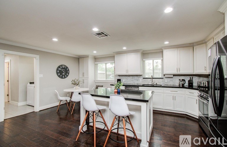 A bathroom with a walk-in shower and a sink.